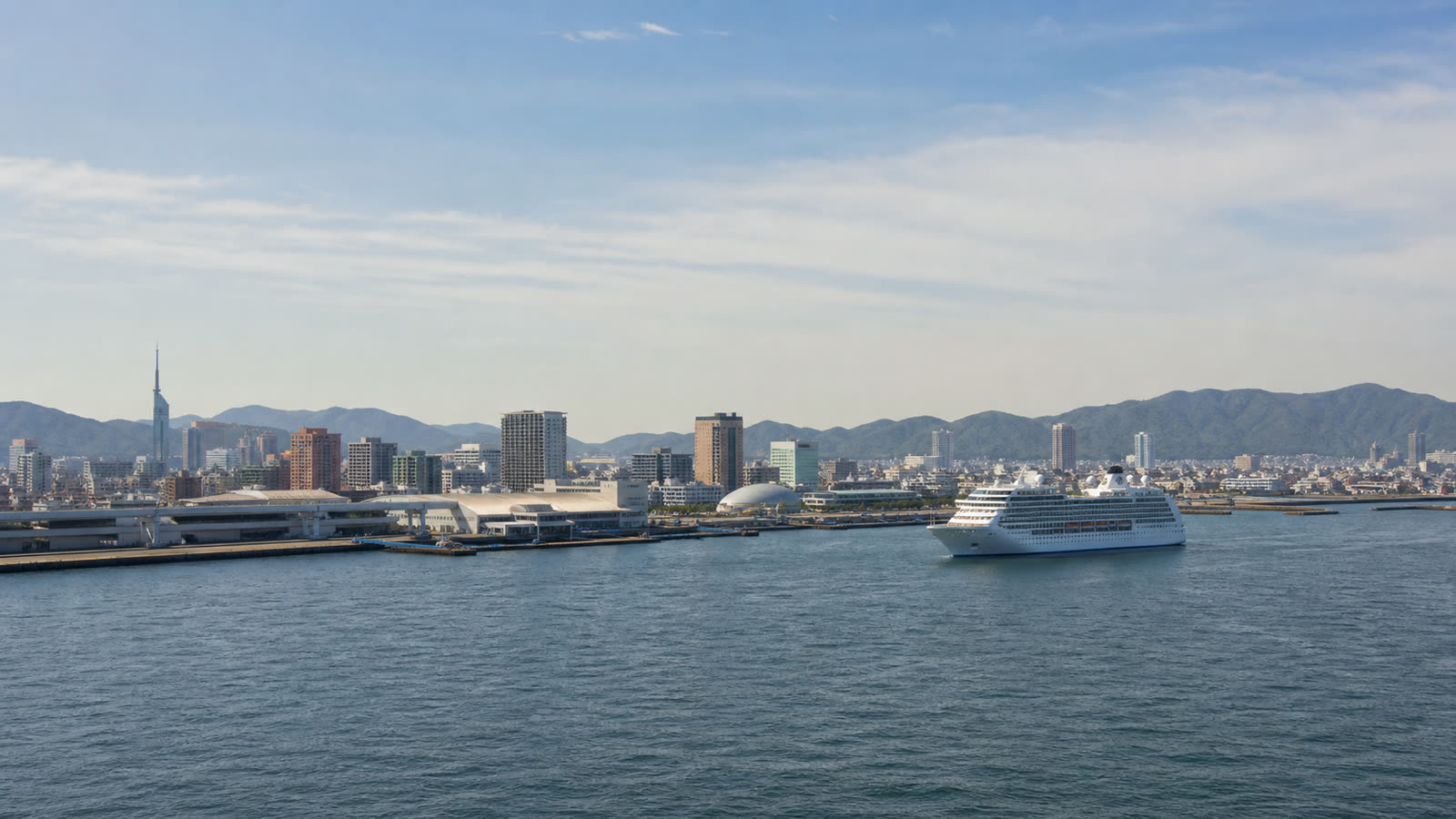 Hakata cruise terminal and Fukuoka waterfront with an unbranded ship
