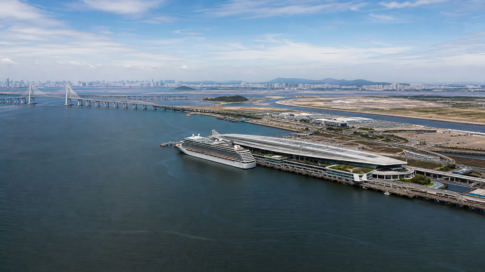 Incheon cruise terminal with an unbranded ship and the distant metropolitan skyline at realistic scale