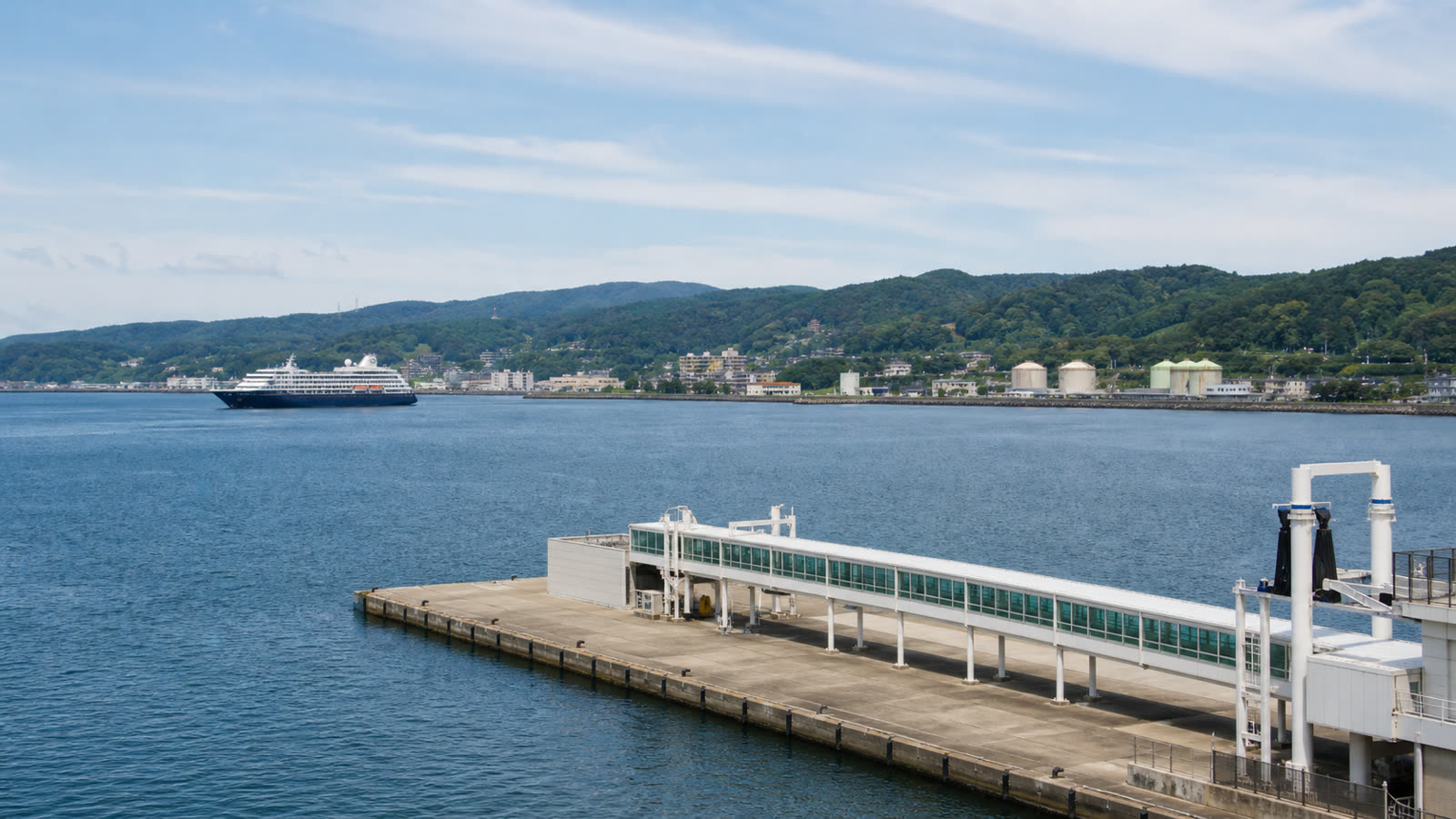 Kanazawa cruise terminal and working harbor with an unbranded ship