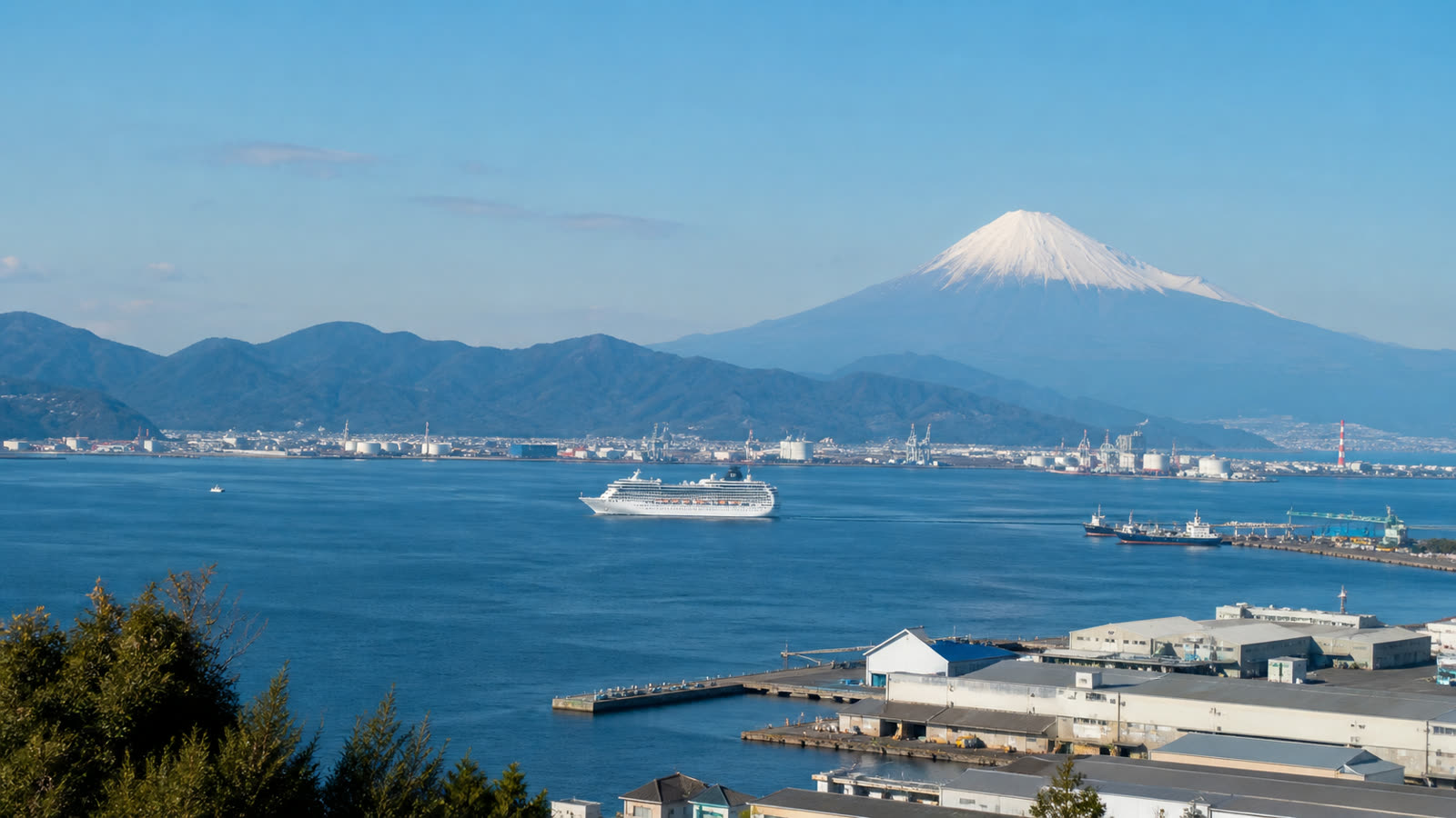 Shimizu cruise harbor with an unbranded ship and Mount Fuji at a natural distant scale