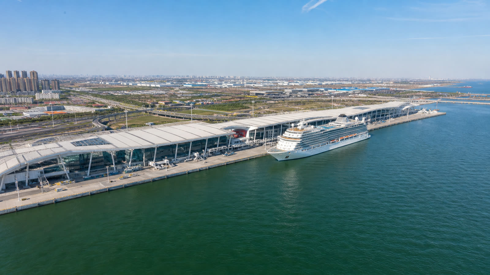 Tianjin cruise home port with an unbranded ship and modern terminal buildings at realistic scale