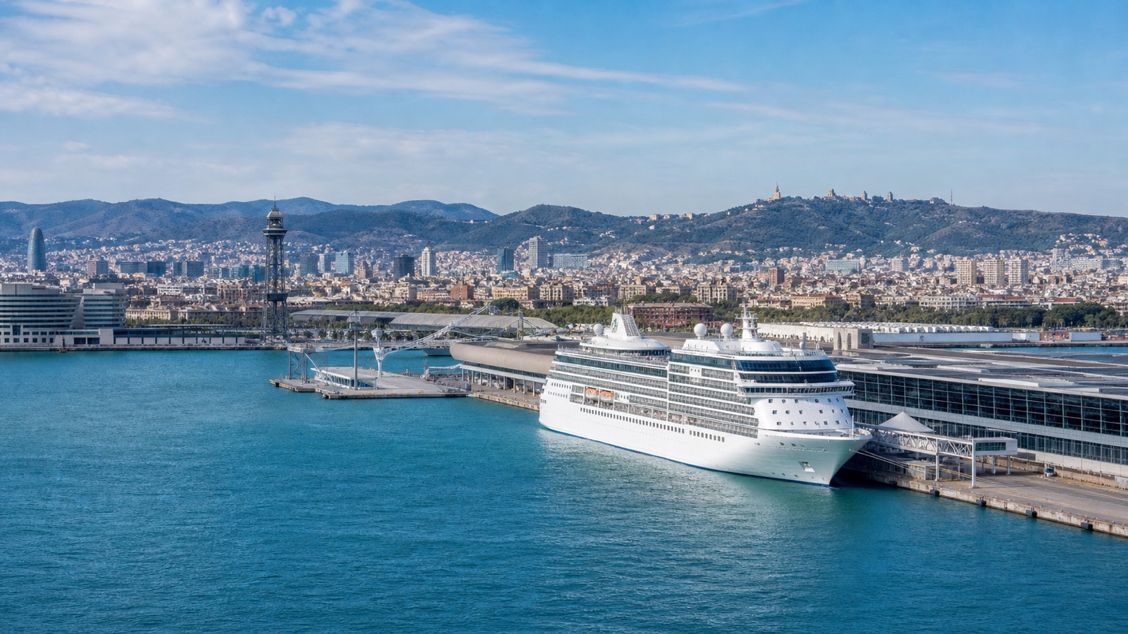 Barcelona cruise terminals and city skyline beneath clear Mediterranean light