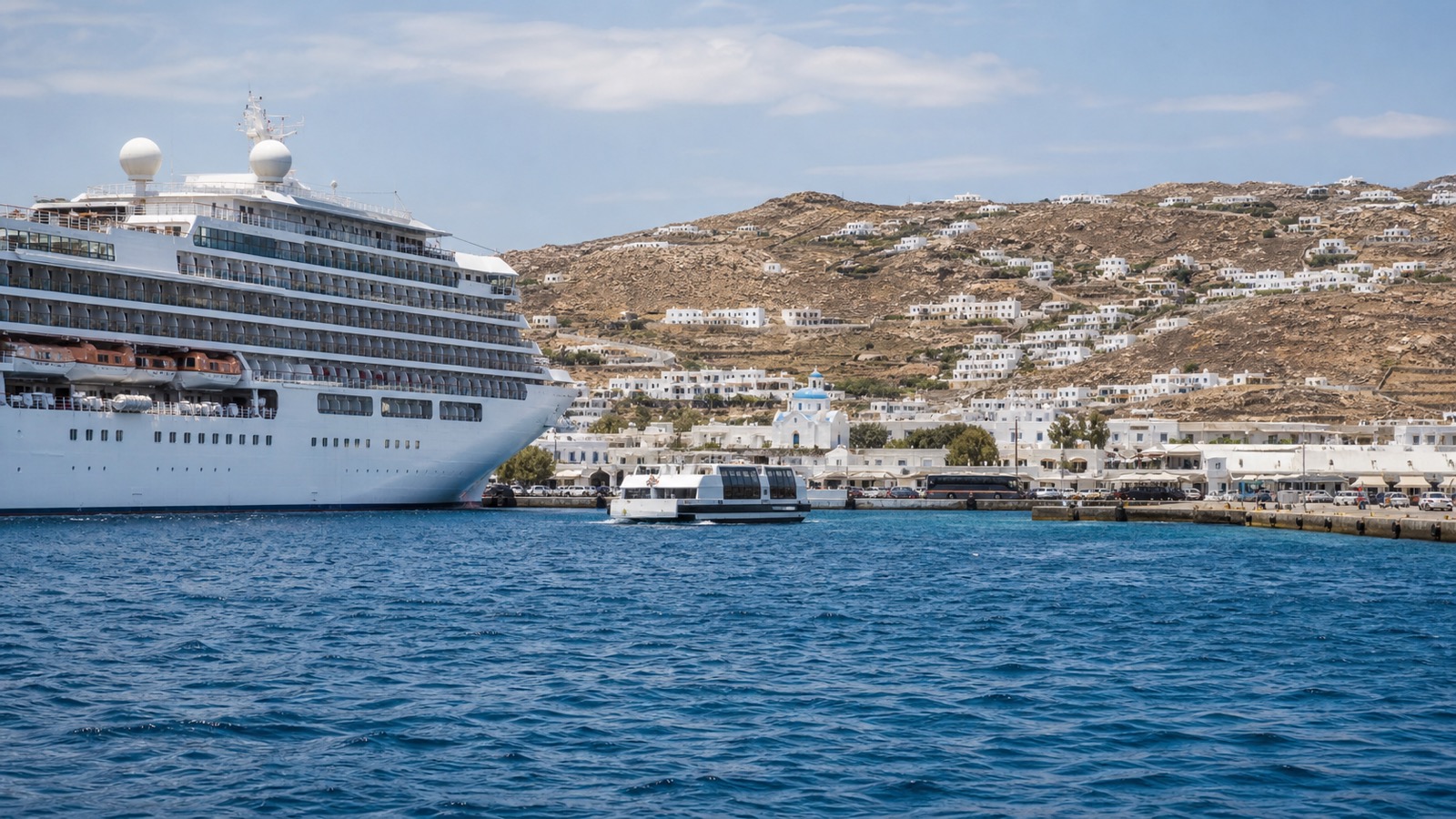 Mykonos cruise arrival at Tourlos with white Cycladic buildings beyond