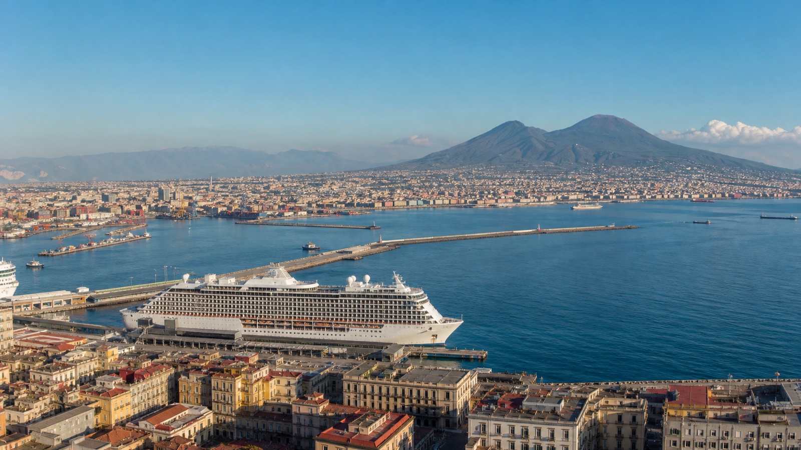Unbranded cruise ship in Naples harbor with Mount Vesuvius across the bay