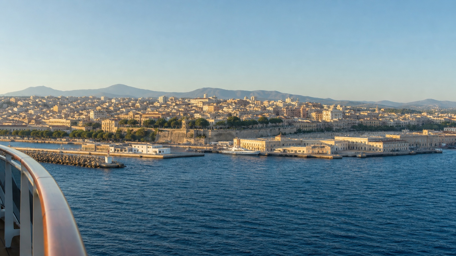 Western Mediterranean waterfront seen from an unbranded cruise ship approaching port