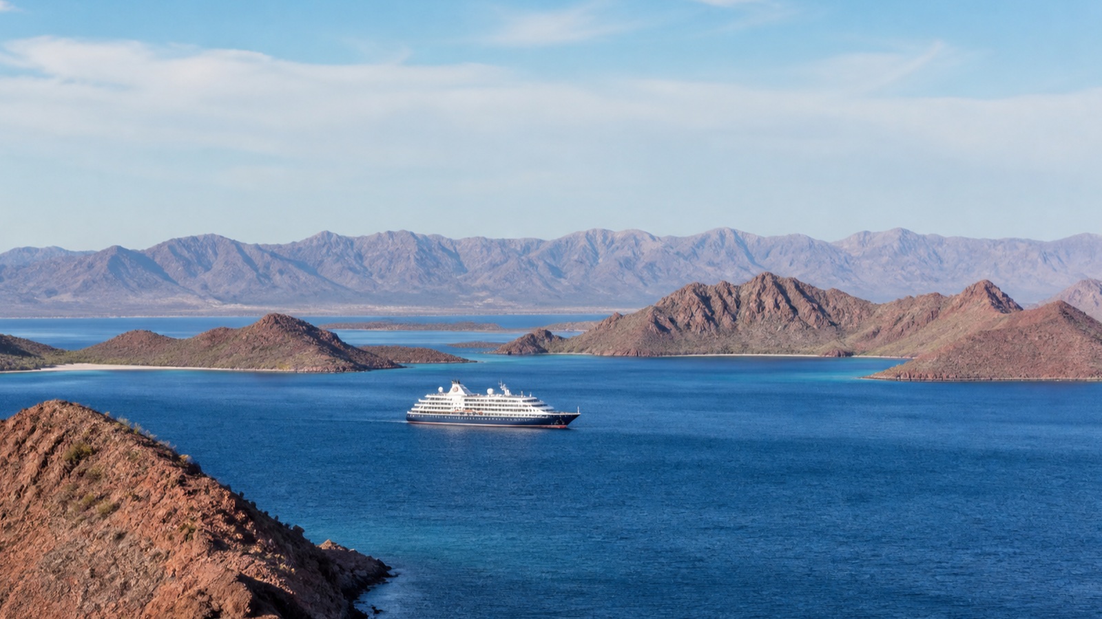 Modest cruise ship crossing the island-studded Sea of Cortez at a natural distance