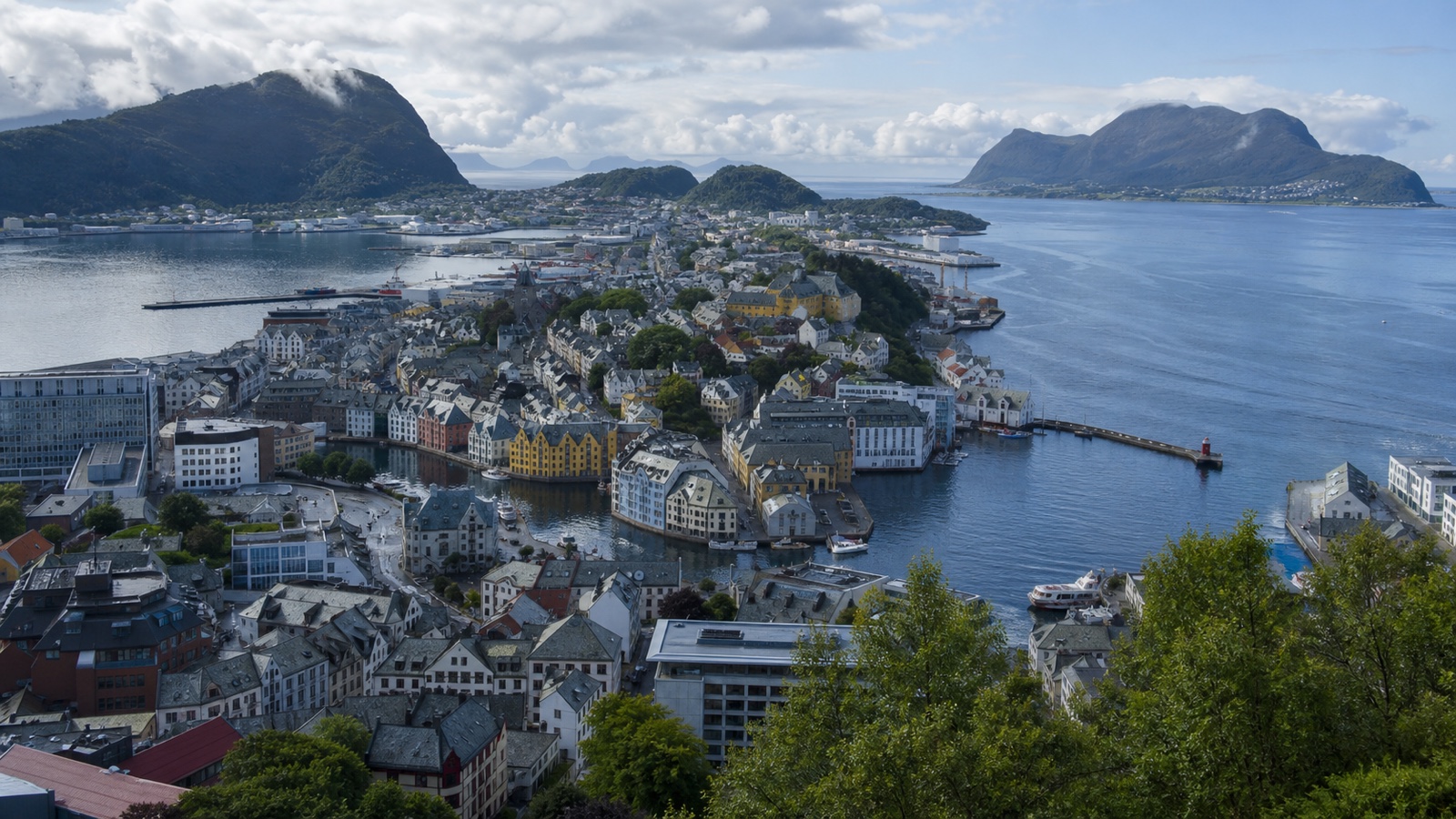 Ålesund harbor and Art Nouveau waterfront with an unbranded cruise ship