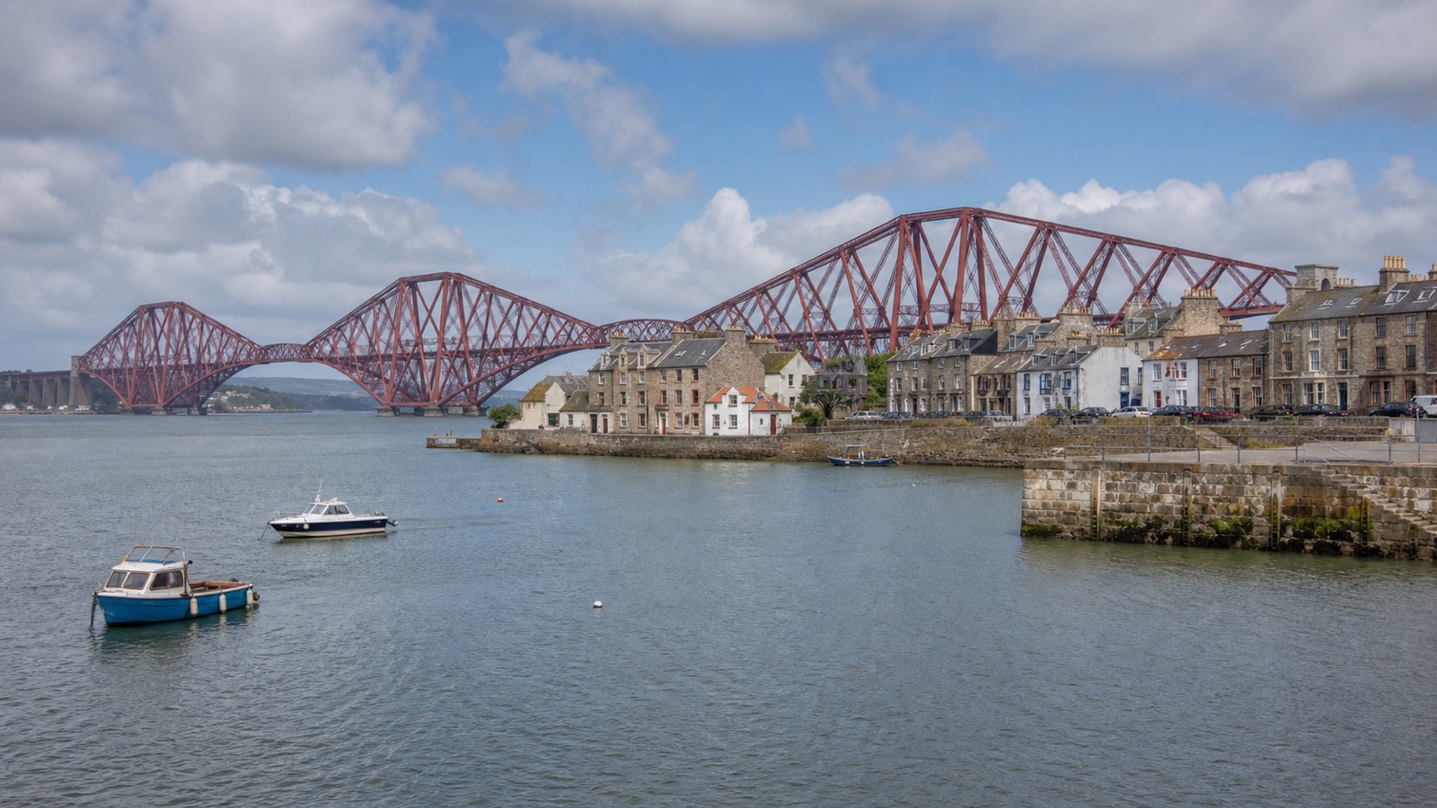South Queensferry waterfront and Forth bridges with an unbranded cruise ship