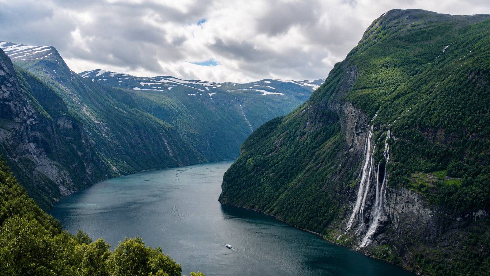Geirangerfjord and village with an unbranded cruise ship in the fjord