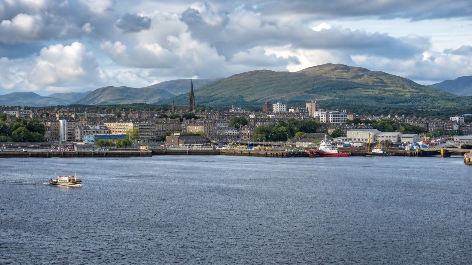 Greenock cruise terminal on the River Clyde beneath Scottish hills