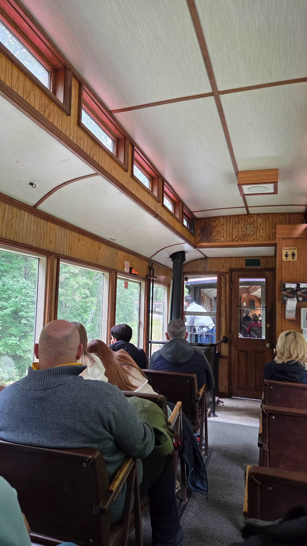 Wood-paneled passenger car interior on the White Pass railway